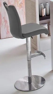 A gray bar stool with a silver base is shown in a room.
