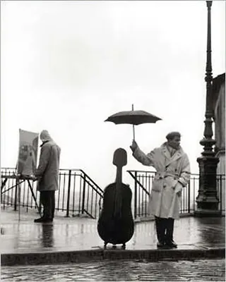 Produktbild von Ein Musiker im Regen Kunstdruck Robert Doisneau + Ü-Poster
