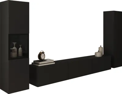 A black modular media unit with a tall cabinet on the left and a shorter, longer unit in the middle, with a tall cabinet on the right. Decorative items are placed on the media unit.