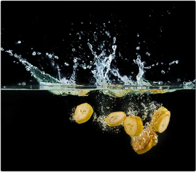 Produktbild von Spritzschutz Herdabdeckplatte Schneidebrett aus Glas Bananen im Wasser 1-Teilig (60x52cm)