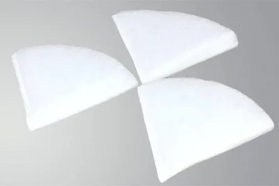 Three white, wedge-shaped filters arranged in a pinwheel formation against a light gray background.