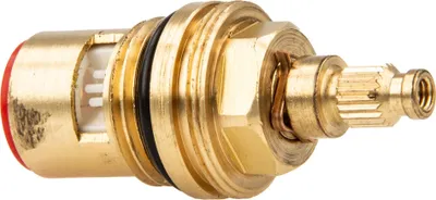 A close-up studio shot of a brass valve cartridge with a red cap and white ceramic elements.