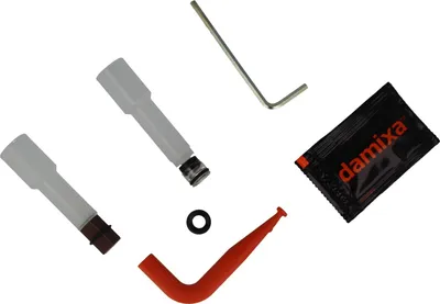 A collection of plumbing repair parts laid out on a white background.