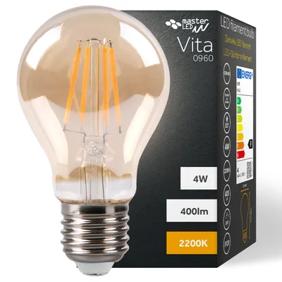 A close-up of a decorative LED filament light bulb with its packaging in the background.