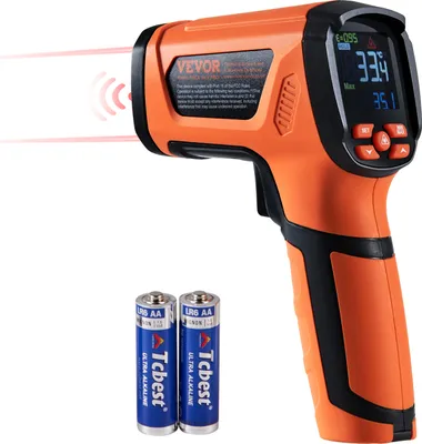An orange and black infrared thermometer with two AA batteries in front of it, set against a white background.