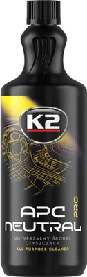 A black bottle of K2 APC Neutral Pro cleaner against a white background with yellow and gold graphic elements.