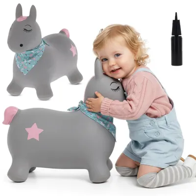 A child hugging a grey inflatable pony toy.