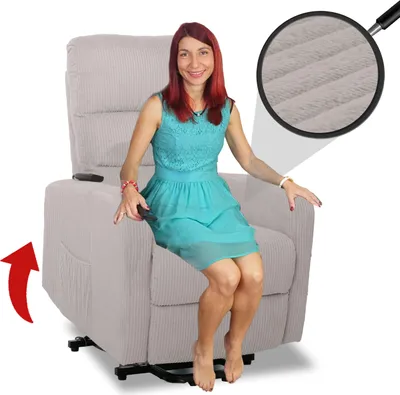 A woman is sitting in a recliner chair, demonstrating its features.