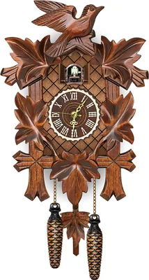 A traditional wooden cuckoo clock with carved leaves and pinecone weights.