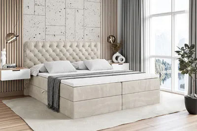 A bedroom scene with a large bed as the focal point.
