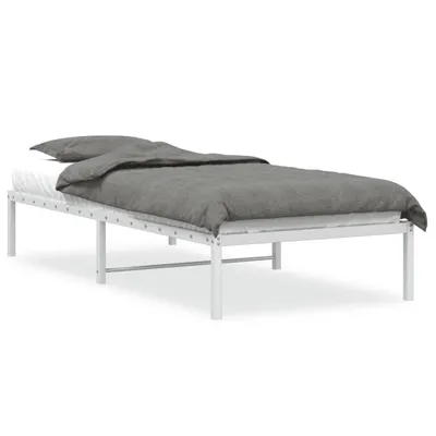 A white metal bed frame with a gray duvet and pillow on a white background.