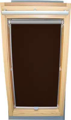 A dark brown roller blind installed in a wooden framed skylight.