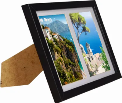 A black photo frame with two scenic pictures, standing on a white background.