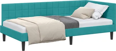 A corner bed frame with a headboard, covered with bedding and pillows.