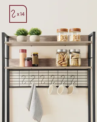 A kitchen shelf unit with shelves, hooks, and mugs.