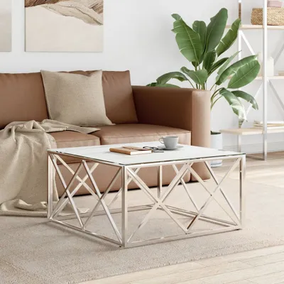 A modern living room scene featuring a brown leather sofa, a coffee table, and a large potted plant.