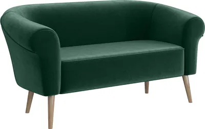 A green velvet mini sofa with wooden legs, shown from the front.