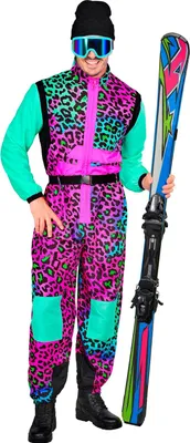 A person wearing a colorful 80s retro ski suit and holding skis.