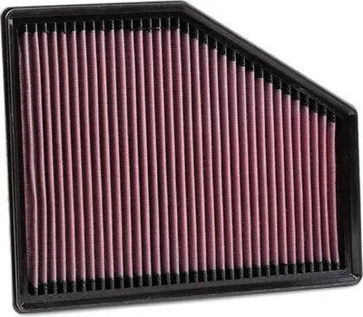 A K&N air filter with red filtering material and a black frame, isolated on a white background.