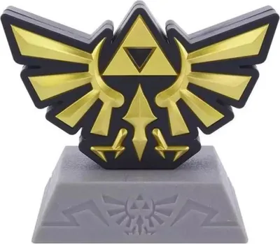 A close-up studio shot of a Zelda Hyrule Crest icon light on a gray base.