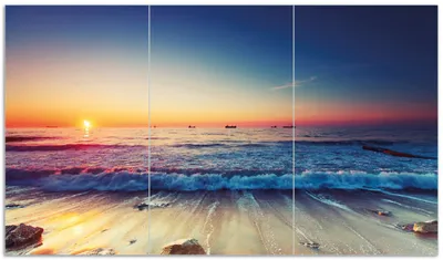 Produktbild von Wallario Herdabdeckplatte aus Glas, Größe 90 x 52 cm 3-teilig, Motiv Sonnenuntergang am Meer mit Wellen am Strand