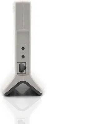 A close-up side view of a gray and black AVM FRITZ!Box 6820 LTE v3 international modem, showing the Ethernet port and indicator lights.