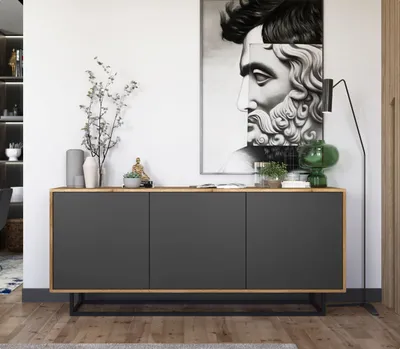 A modern living room with a sideboard and artwork.