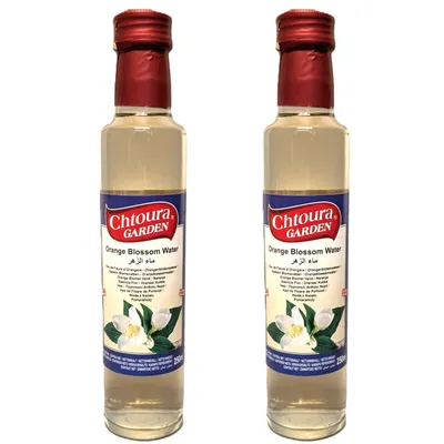 Two bottles of orange blossom water are displayed side-by-side against a white background.