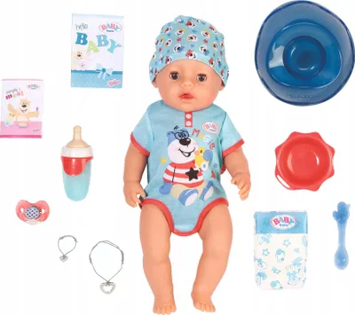 A baby doll and its accessories are laid out on a white background.