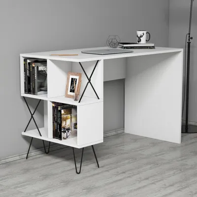 A white desk with built-in shelving is shown against a gray wall and on a light gray floor.