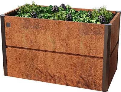 A rectangular raised garden bed made of corten steel with a rust-like finish, filled with green plants.