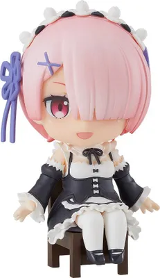 A Nendoroid figure of Ram from Re:Zero Starting Life in Another World, sitting on a small brown chair.