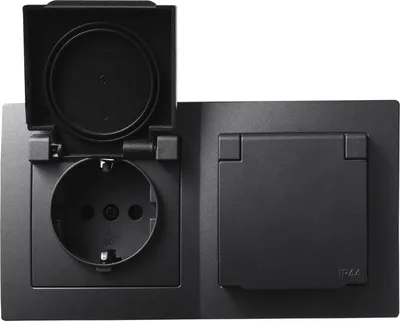 A black electrical outlet with a protective cover and a separate covered outlet.