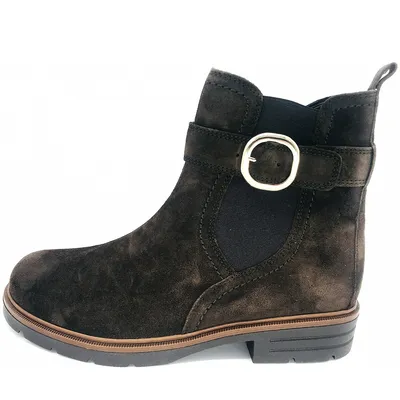 A side view of a brown suede boot with a buckle detail.