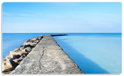 Produktbild von Wallario Frühstücksbrettchen aus Glas, je 14 x 23 cm, mit rutschfesten Füßen, Motiv Pier am blauen Ozean mit blauem Himmel