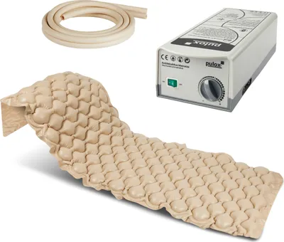 A medical air mattress and pump set, including a coiled tube, displayed against a white background.