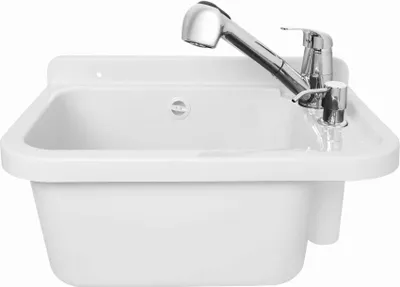 A white sink with a chrome faucet and soap dispenser against a white background.