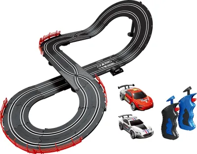 A toy race car track with two cars and controllers.