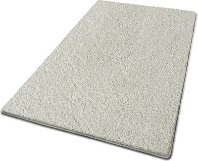 A shaggy rug is shown from a slightly elevated angle against a white background.