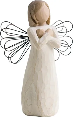 A carved wooden angel figurine with wire wings.