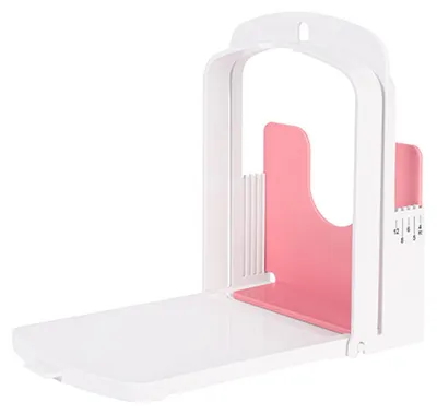 A white and pink bread slicer on a white background.
