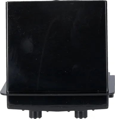 A black product with small black nubs on the bottom.