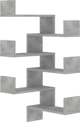 A gray, zig-zag shaped wall shelf unit.