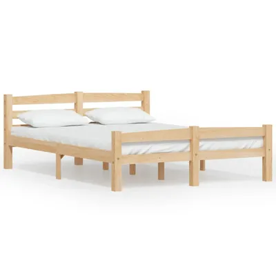 A wooden bed frame with two mattresses and pillows, shown against a white background.