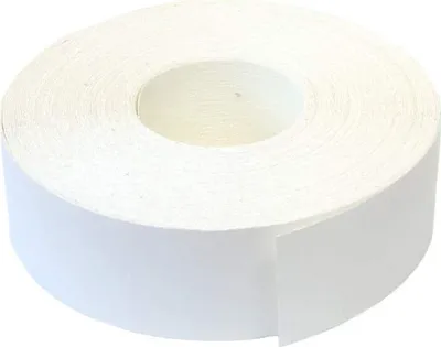 A roll of white tape on a white background.