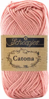 A ball of pink yarn with a label.