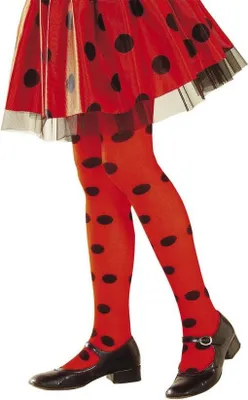 A person's legs wearing red polka dot tights and black shoes.