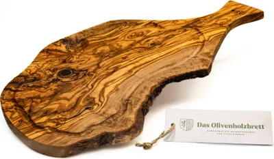 A wooden cutting board with a handle and a juice groove, placed on a white background with a product tag.