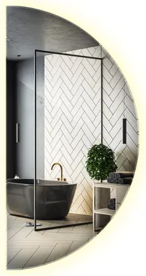 A modern bathroom with a black bathtub, herringbone tile wall, and a plant on a shelf.