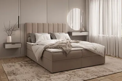 A bedroom scene featuring a bed, nightstand, and window with curtains.